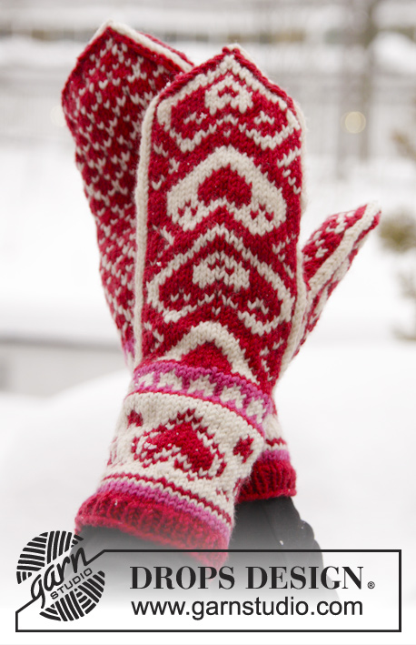 The Heart of the Mitten / DROPS Extra 0-1011 - DROPS Valentine: Knitted DROPS mittens with hearts in ”Merino Extra Fine”.