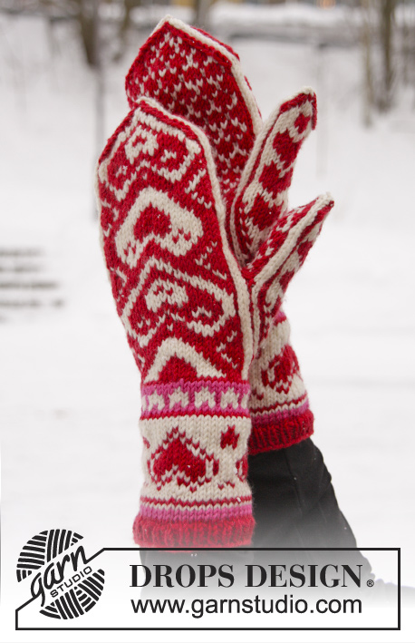 The Heart of the Mitten / DROPS Extra 0-1011 - DROPS Valentine: Knitted DROPS mittens with hearts in ”Merino Extra Fine”.