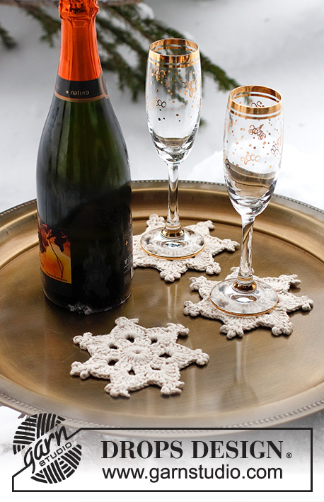 Cheers! / DROPS Extra 0-1566 - Hvězdička – podložka / podkafník háčkovaná z příze DROPS Paris. Motiv: Vánoce