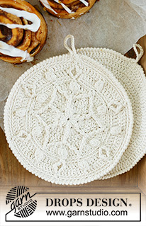 Ice Star Potholders / DROPS Extra 0-1577 - Crocheted pot-holders in DROPS Paris. The piece is worked in a circle, from the middle outwards, with stars and bobbles. Theme: Christmas.