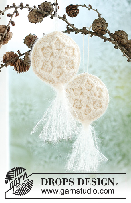 Frozen Flowers / DROPS Extra 0-1589 - Crocheted Christmas ball in DROPS BabyMerino and DROPS Kid-Silk. Piece is crocheted in 2 parts in the round from the centre and outwards, with relief pattern, start and tassel. Theme: Christmas.