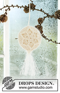 Frozen Flowers / DROPS Extra 0-1589 - Crocheted Christmas ball in DROPS BabyMerino and DROPS Kid-Silk. Piece is crocheted in 2 parts in the round from the center and outwards, with relief pattern, start and tassel. Theme: Christmas.