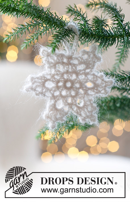Frozen Star / DROPS Extra 0-1590 - Fiocco di neve a forma di stella lavorata all’uncinetto in DROPS Kid-Silk. Tema: Natale.