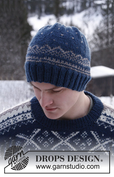 Nordic Midnight Hat / DROPS Extra 0-810 - Knitted DROPS men's hat with Norwegian pattern in ”Karisma”.