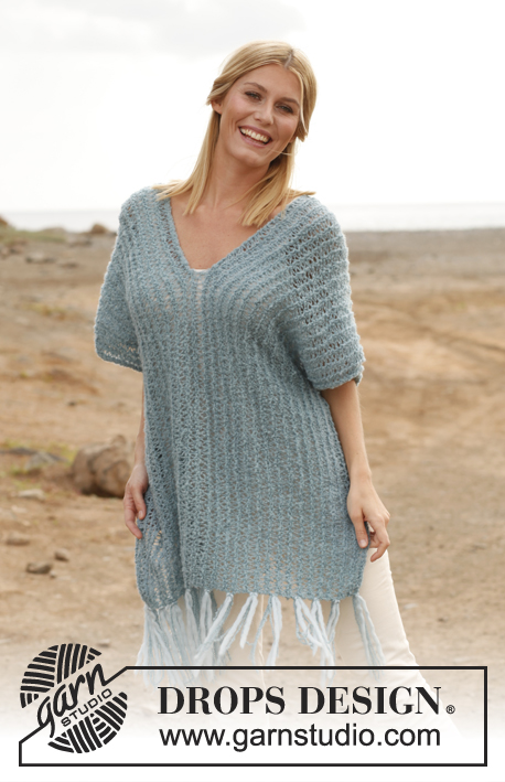 DROPS Extra 0-832 - Knitted DROPS poncho in ”Alpaca Bouclé” with fringes in “Snow”.