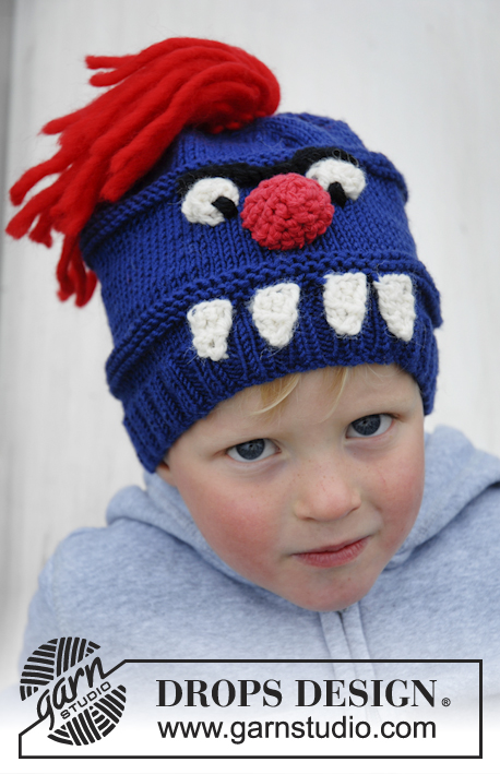 Tooth Monster / DROPS Extra 0-931 - Bonnet monstre tricoté pour enfant en DROPS Merino Extra Fine, avec des yeux, un nez, des dents et des cheveux. Du 3 au 12 ans.
