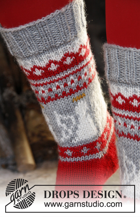 Angel Feet / DROPS Extra 0-989 - DROPS Weihnachten: Gestrickte DROPS Socken mit Engeln in „Karisma“. Größe 32-43.