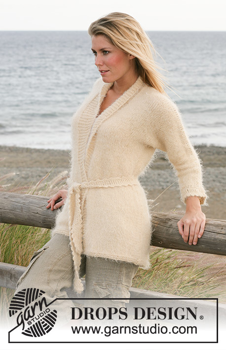 DROPS 100-13 - DROPS cardigan knitted in stockinette stitches with crochet details and belt in “Symphony”.
