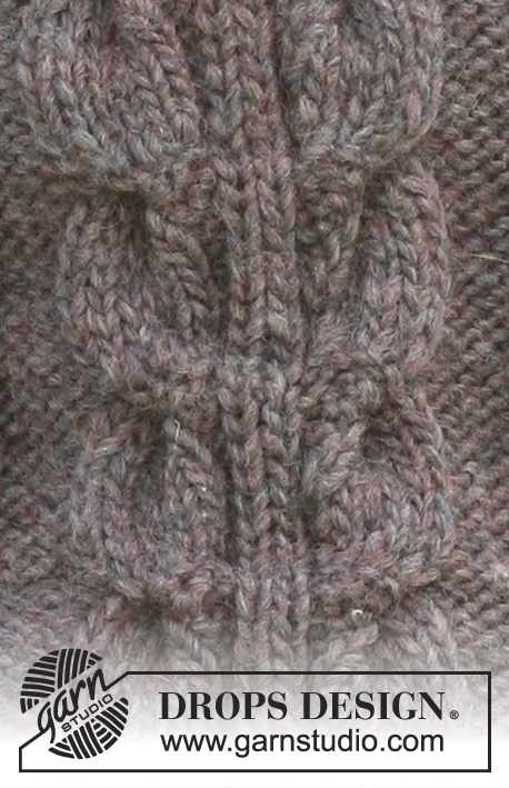 DROPS 102-35 - Długi sweter na drutach, z irlandzkim wzorem, z krótkim rękawem, z włóczki DROPS Snow