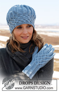 DROPS 115-13 - DROPS hat and gloves in ”Merino Extra Fine” with cables. 