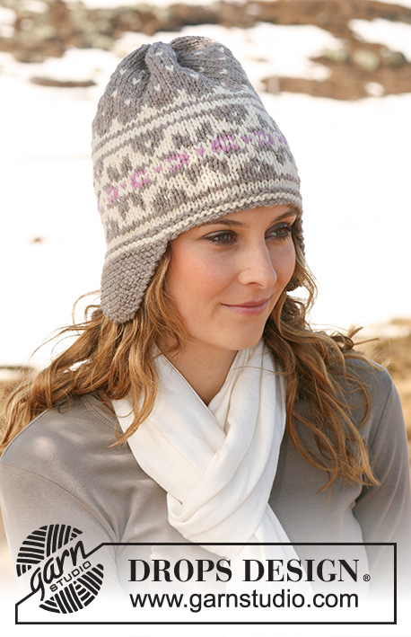 Highland Dew Hat / DROPS 116-34 - DROPS hat in ”Alaska” with earflaps and Norwegian pattern. 