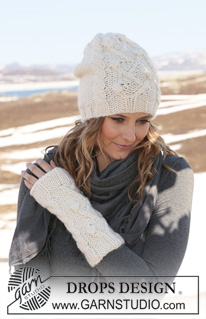 DROPS 116-41 - Set comprises: Knitted DROPS hat and wrist warmers with cables in ”Snow”.