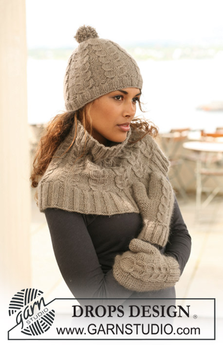 DROPS 125-12 - Set comprises: Knitted DROPS hat, neck warmer and mittens with cables in ”Merino Extra Fine” and ”Kid-Silk”.