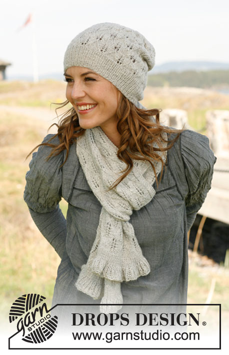 Sweet Caroline / DROPS 131-11 - Set consists of: Knitted DROPS scarf and hat with lace pattern in “Alpaca”.