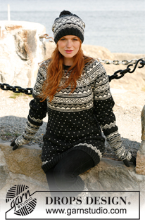 Nordic Night / DROPS 131-13 - Knitted DROPS hat with Norwegian pattern and large pompom in ”Karisma”. 