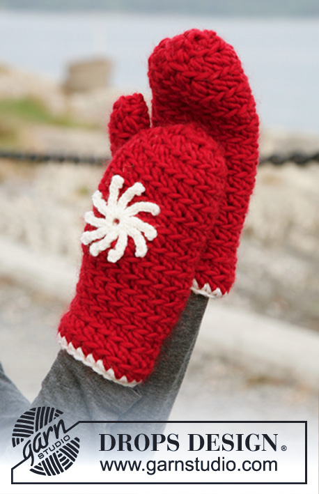 Snowflake / DROPS 131-18 - Souprava obsahuje: DROPS háčkovanou čepici a rukavice z příze „Snow“ nebo „Andes“ s kytičkou z příze „Karisma“. 

