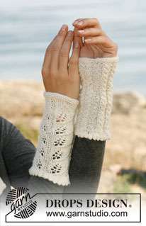 Autumn Leaves / DROPS 133-33 - Knitted DROPS wrist warmers with lace pattern and cables in “Alpaca”.