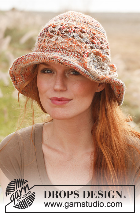 Pastorale / DROPS 139-9 - Crochet DROPS hat with flower in ”Fabel” and “Lin” og Fabel” and “Belle”.