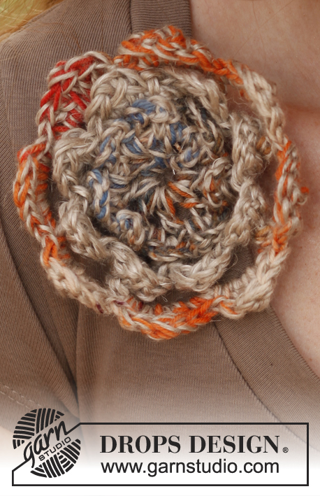 Pastorale / DROPS 139-9 - Crochet DROPS hat with flower in ”Fabel” and “Lin” og Fabel” and “Belle”.