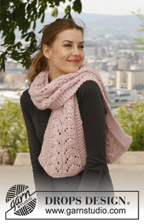 Abbraccio Rosa / DROPS 141-32 - Set consists of: Knitted DROPS hat and neck warmer with lace pattern in ”Snow”.