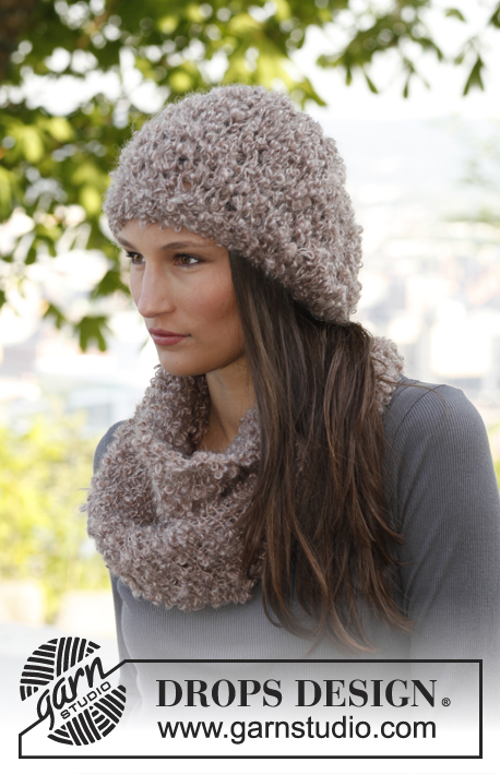 Annouchka / DROPS 143-25 - Set consists of: Knitted DROPS hat and neck warmer in ”Puddel”.