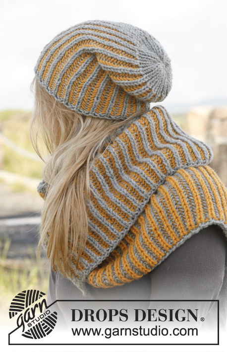 Nina / DROPS 149-43 - Knitted DROPS hat and neck warmer with English rib in two colors in ”Nepal”.
