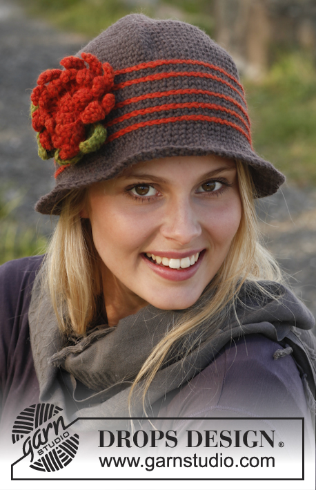 Miss Potter / DROPS 150-2 - Gehaakte DROPS hoed met strepen en bloemen van ”Lima”.
