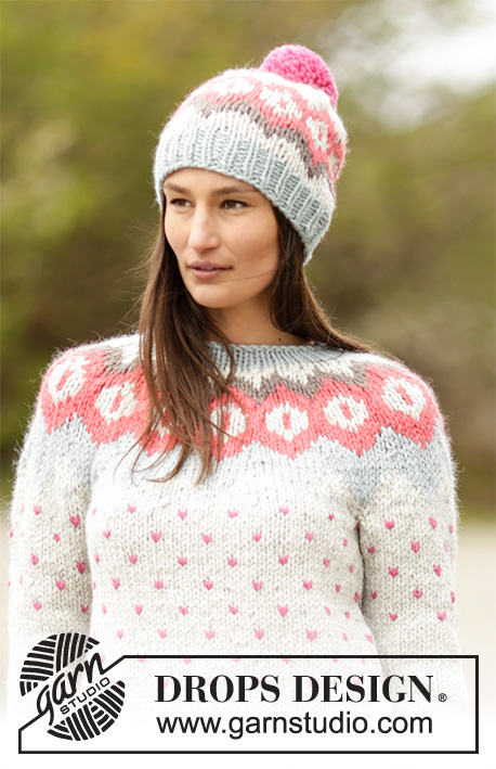 Winter Poppies / DROPS 164-28 - Settet består av: Stickad DROPS tröja med runt ok och nordiskt mönster och mössa med nordiskt mönster och garnboll i ”Andes”. Stl S - XXXL