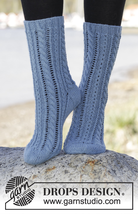Heavenly Blue / DROPS 166-28 - Knitted DROPS socks with lace pattern and cables in Fabel. Size 35 - 43