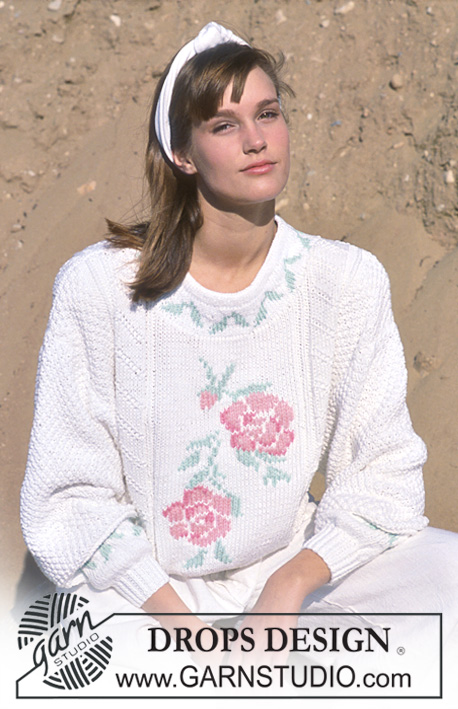 DROPS 18-3 - Sweter na drutach, z żakardem w róże, z włóczki DROPS Paris. Od S do L.