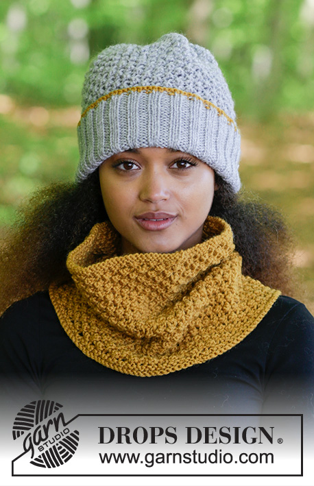 Welcome Winter / DROPS 180-13 - Set consists of: Knitted hat and neck warmer with Blueberry pattern.
Set is knitted in DROPS Alaska.