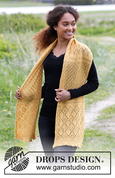 Dreamy Daffodil / DROPS 180-14 - Knitted stole with lace pattern and rib.
The piece is worked in DROPS Alpaca.