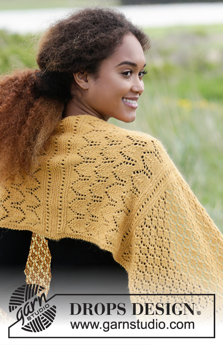 Dreamy Daffodil / DROPS 180-14 - Knitted stole with lace pattern and rib.
The piece is worked in DROPS Alpaca.