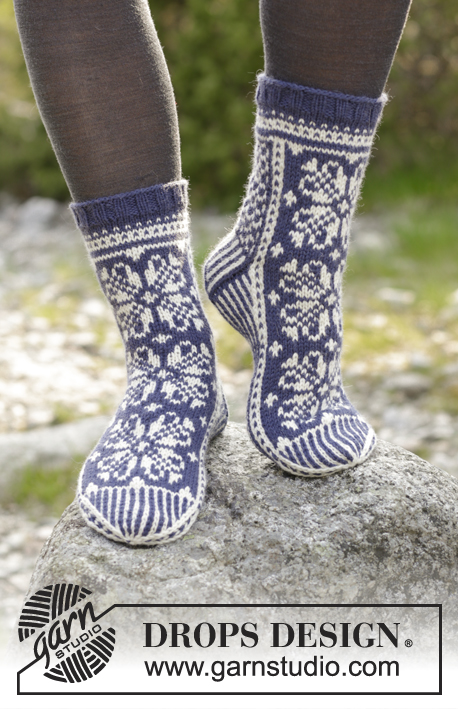 Lofoten Socks / DROPS 181-12 - Knitted socks with multi-colored Norwegian pattern. 
Piece is knitted in DROPS Lima.