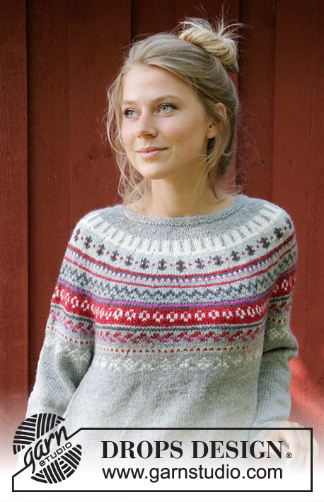 Winter Berries / DROPS 181-16 - The set consists of: Knitted jumper with round yoke, multi-coloured Norwegian pattern and A-shape, worked top down. Sizes S - XXXL. Wrist warmers with multi-coloured Norwegian pattern.
The set is worked in DROPS Karisma.