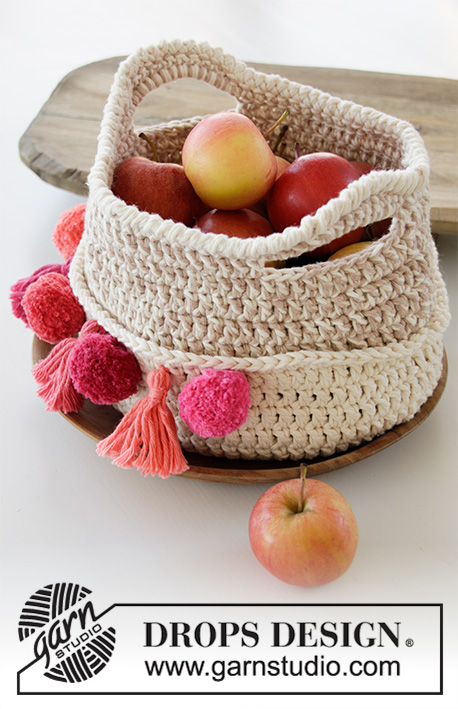 Can Can / DROPS 189-9 - Crochet basket with pom poms and tassels. The piece is worked with 2 strands DROPS Paris.