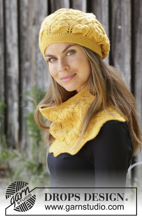 Golden Leaves / DROPS 192-16 - Knitted hat with lace pattern in DROPS Lima. Piece is knitted with lace and textured pattern. 
Knitted neck warmer with lace pattern in DROPS Lima. Piece is knitted with lace and textured pattern.