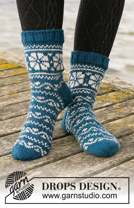Fabled Cottage / DROPS 203-25 - Knitted socks in DROPS Karisma. The piece is worked top down with Nordic pattern. Sizes 35 - 43.