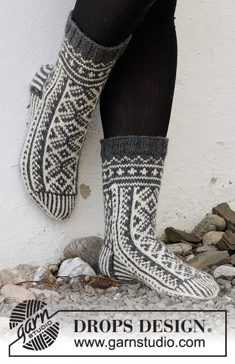 Sleigh Ride / DROPS 214-63 - Knitted socks in DROPS Lima. Piece is knitted top down with Nordic pattern. Size 35 to 43 Theme: Christmas