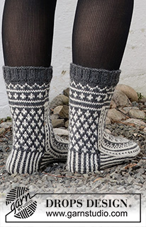 Sleigh Ride / DROPS 214-63 - Stickade sockor i DROPS Lima. Arbetet stickas uppifrån och ner med nordiskt mönster. Storlek 35 - 43. Tema: Jul