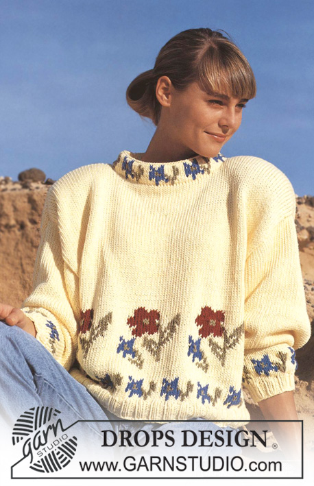 DROPS 22-8 - Sweter na drutach, z żakardem w kwiaty, z włóczki DROPS Paris.