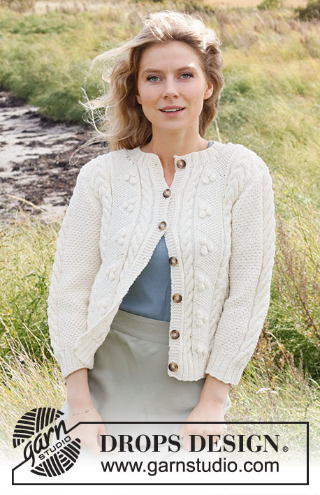 Bright Sand Shore Cardigan / DROPS 222-19 - Knitted jacket in DROPS Merino Extra Fine. The piece is worked with cables, bobbles and ¾-length sleeves. Sizes S - XXXL.