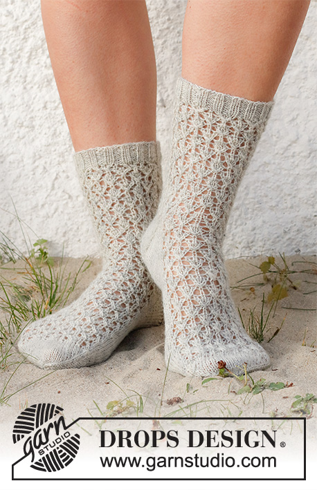 Rain Runners / DROPS 223-43 - Knitted socks in DROPS Nord. The piece is worked with lace pattern. Sizes 35-43.