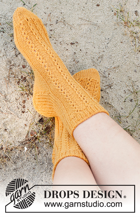 Sunshine Comfort / DROPS 223-45 - Knitted socks in DROPS Nord. Piece is knitted top down with rib and false cables. Size 35 to 43 = US 4 1/2 – 12 1/2.