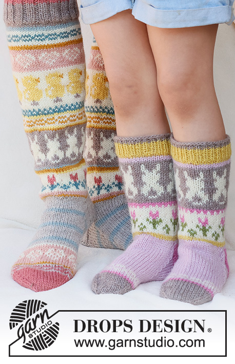 Easter Dance Socks / DROPS 229-35 - Knitted socks in DROPS Karisma. The piece is worked top down in stocking stitch, with multi-coloured pattern and heart, Easter chick, Easter bunny and flower. Sizes 35 - 43. Theme: Easter.