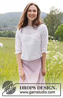 Mountain Frill / DROPS 230-35 - Knitted jumper with ¾ sleeves in DROPS Nord. Piece is knitted top down with round yoke and lace pattern on yoke. Size: S - XXXL