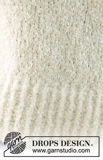 Soft Journey / DROPS 230-9 - Gebreide trui in DROPS Alpaca Bouclé en DROPS Kid-Silk. Het werk wordt van onder naar boven gebreid in tricotsteek, split in de zijkanten en ¾-lengte mouwen. Maten S - XXXL.