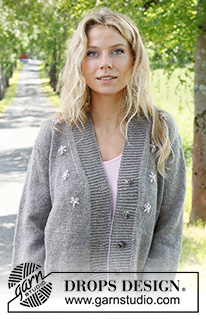 Shy Daisy Cardigan / DROPS 231-33 - Knitted jacket in DROPS Merino Extra Fine. Piece is knitted bottom up in stockinette stitch and embroidered flowers. Size: S - XXXL