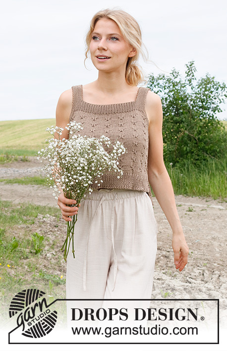 Midsummer's Day / DROPS 232-24 - Knitted top / singlet in DROPS Cotton Light. Piece is knitted bottom up with relief pattern. Size: S - XXXL