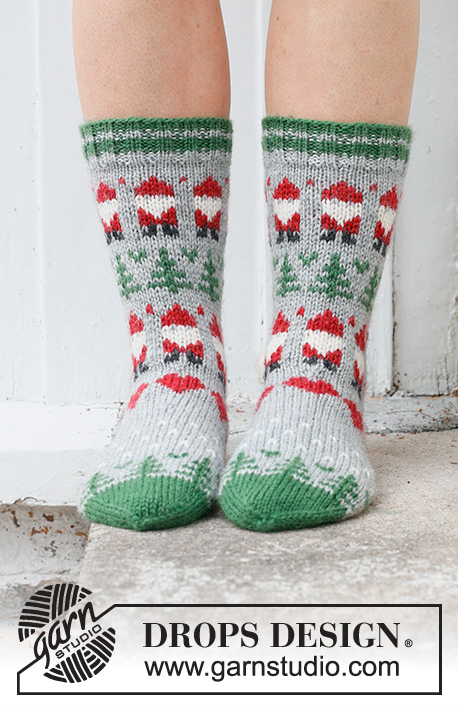 Christmas Time Socks / DROPS 234-63 - Knitted socks in DROPS Karisma. The piece is worked top down with coloured Santa, Christmas tree and heart-pattern. Sizes 35 – 43. Theme: Christmas.